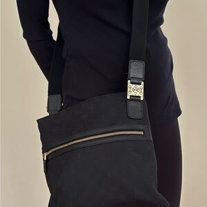 Chic Black Crossbody Bag with Gold Accents